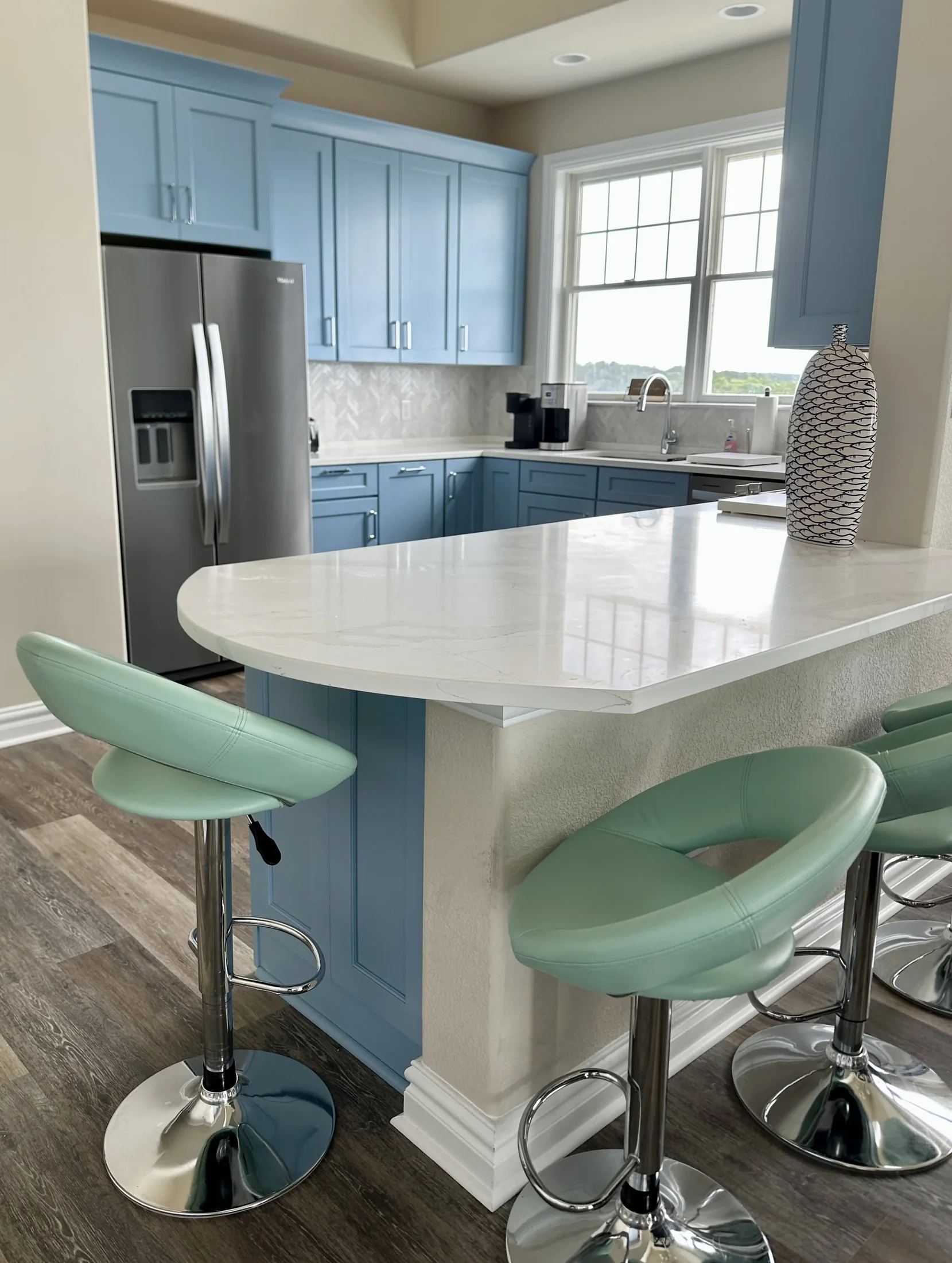Blue kitchen with compact island